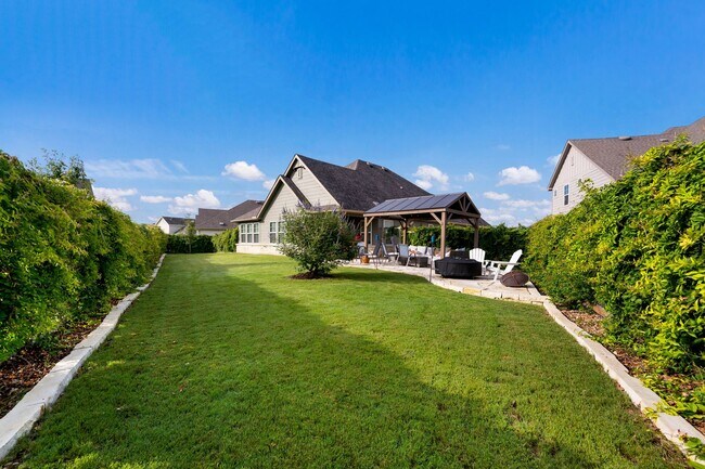 Building Photo - 4 Bedroom Home with Stone Patio, Built-In Gazebo & Amenity-Rich Community Living