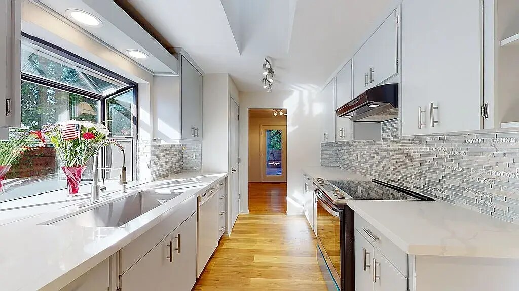 Remodeled kitchen with skylight and bay window - 7302 139th PL NE