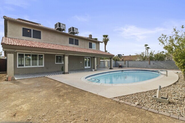 Building Photo - Welcome to your entertainers dream home with solar and pool service included!