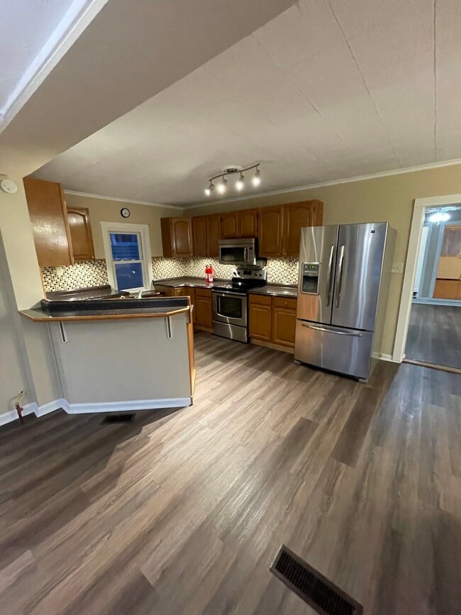 kitchen with fridge, oven, microwave, and dishwasher - 2310 Old Berwick Rd