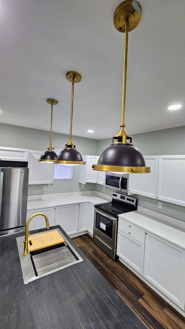 Building Photo - Stunning Renovation Ready for Your Finishing Touches!