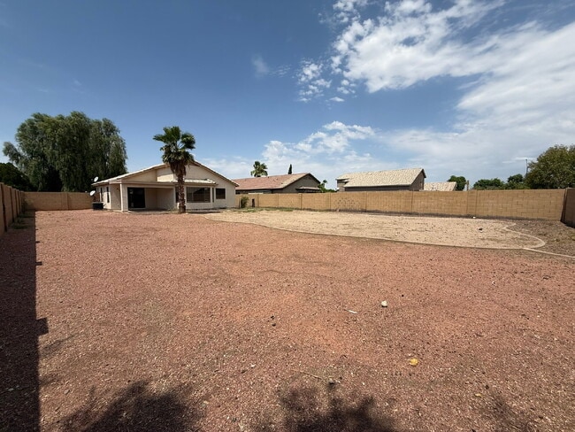 Building Photo - Spacious 4-Bedroom Home with Large Backyar...