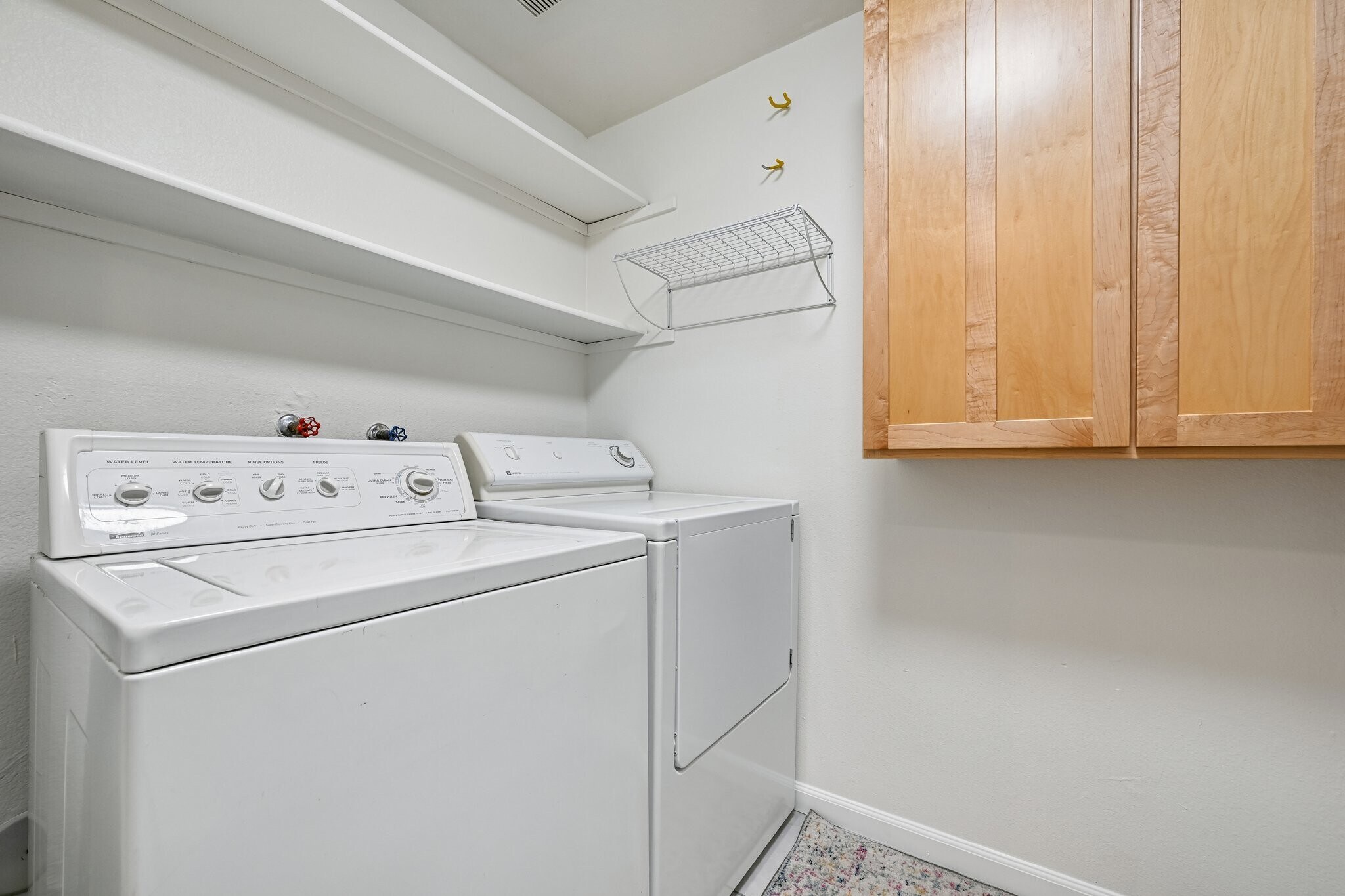 laundry room with plenty of storage - 8747 E Dry Creek Rd
