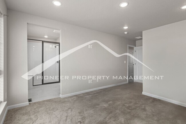 Building Photo - Contemporary Townhome in the Vibrant Interquest Low Maintenance Community with 2 car garage, Wash...