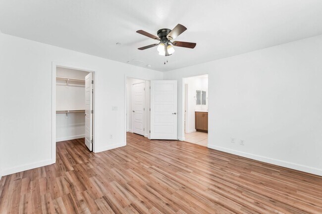 Building Photo - Modern Gated Townhome with Flexible Living Spaces & Stylish Finishes!