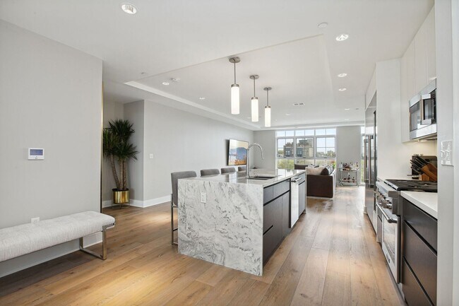 Building Photo - Elegant 2BR at The Adora | 1,500+ SF, Chef’s Kitchen & Garage Parking!