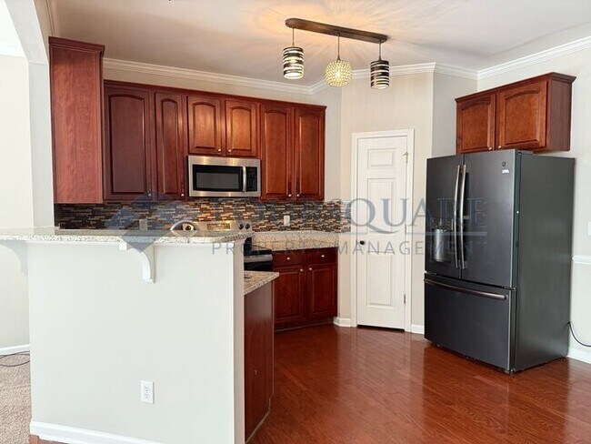 Building Photo - Lovely 3-Bedroom Townhome with Fireplace, Back Patio  & Community Amenities Included! Convenient ...