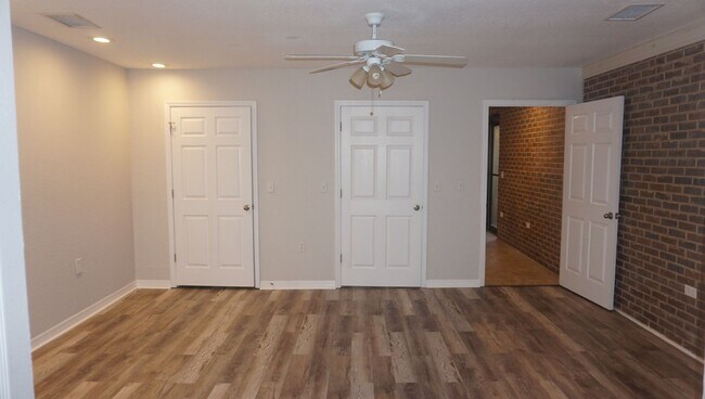 Building Photo - Four Bed - Three Bath - Large Storage Area...