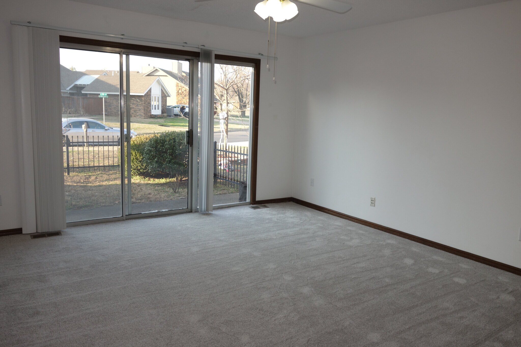1st bedroom with sliding patio door - 3324 E 73rd St