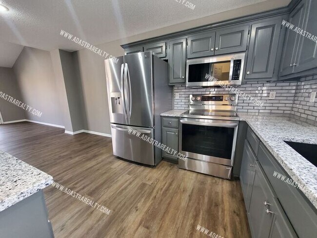 Building Photo - Gorgeous Modern Shawnee Townhome!! So much...