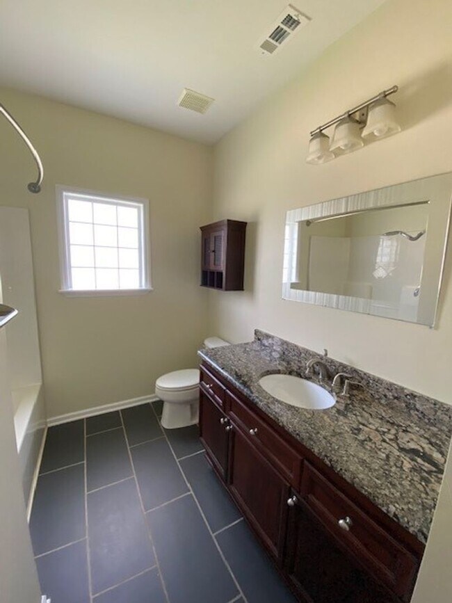 Building Photo - Welcome to this stunning 3-bedroom, 2-bath...