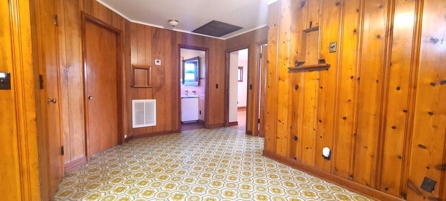 Building Photo - HALF OFF FIRST MONTH RENT! Single family brick home with full unfinished bsmt & detached garage