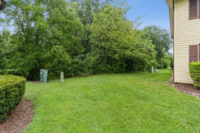 Lots of yard space to the left of this townhome! - 8407 Alameda Ct