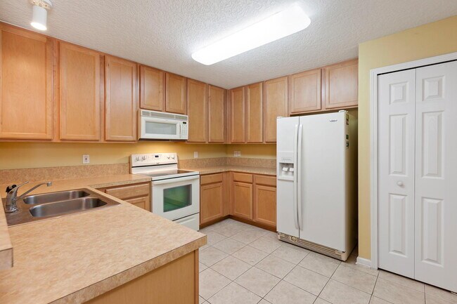 Building Photo - Beautifully Updated & Spacious 3BR/2BA Condo in a Secure Gated Community — Includes Cable, Intern...