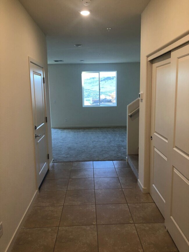 Building Photo - CORNER LOT - END UNIT - NO YARD TO MAINTAIN - GRANITE - STAINLESS - GATED