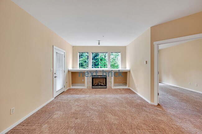 Building Photo - Rare Ground-Floor, End Unit with massive b...