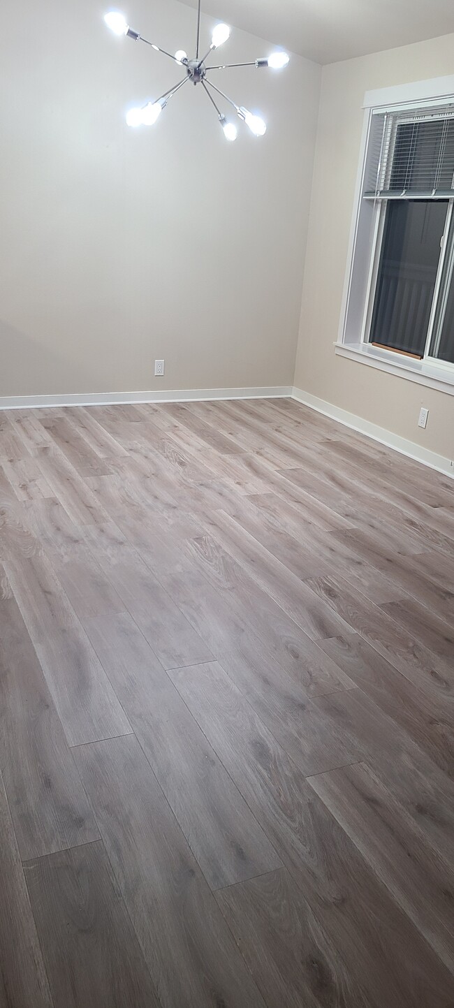 Replaced carpet with engineered wood flooring throughout the unit - 3034 128th Ave SE