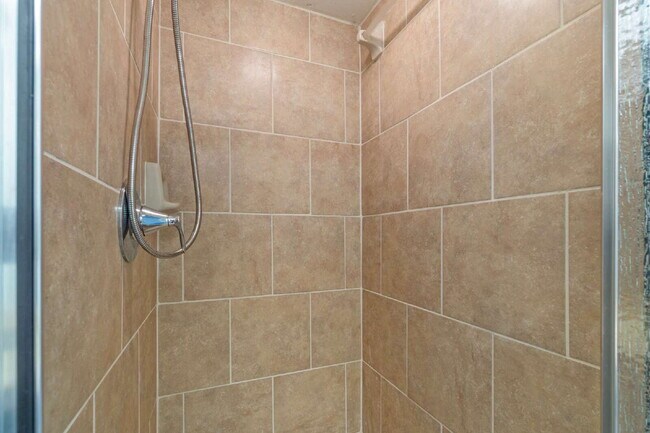 Building Photo - Freshly Updated 2BR Condo with Private Balcony, Community Pool, & In-Unit Laundry