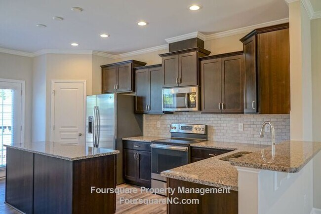 Building Photo - Modern 3-Story Townhome with Entry-Level Bonus Room, Back Deck & Garage , Community Pool in North...