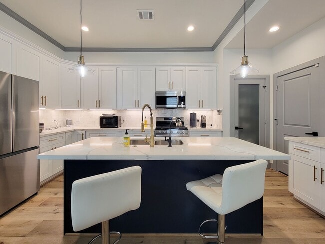 Building Photo - This 4-bedroom, 3-bathroom, two-story residence comes with a generous two-car attached garage. Re...