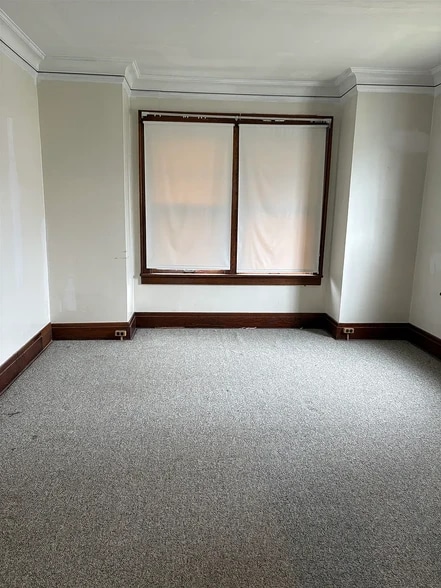 master bedroom large 5 windows ground level - 99 E Orvis St