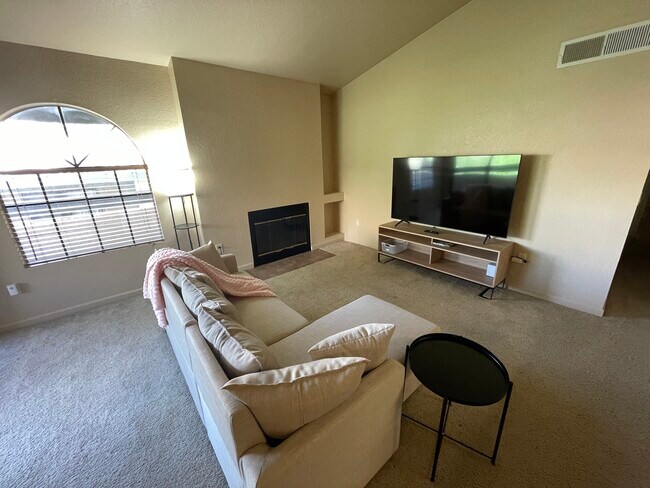 Living room w/65" TV - 101 S Players Club Dr