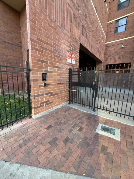 Gated entrance with security system - 1301 Speer Blvd