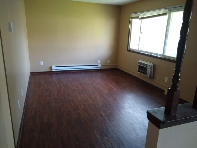 Living room with new vinyl plank floor - 2378 Zircon St NE
