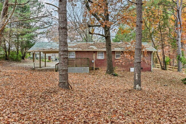 Building Photo - Cozy 3BR Home with Spacious Yard & XL Carport!