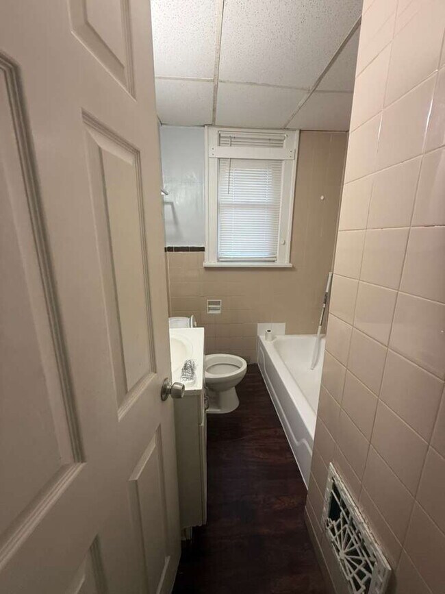 Building Photo - "Charming 2-Bedroom St. Louis Home with Gleaming Hardwood Floors in 63121!"