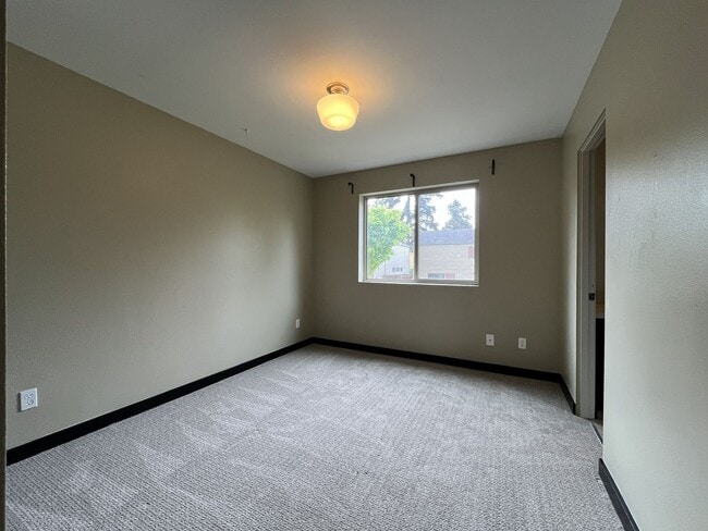 Building Photo - Charming 3 Bedroom, 2.5 Bathroom Home with Large Living Room, Tall Windows, Island Kitchen, and A...