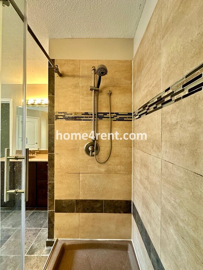 Building Photo - Beautiful Four-Bedroom Home with Three Car Garage, Wood Floors, Finished Basement and a Fenced Ya...