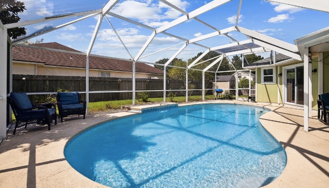 Building Photo - private - backyard fenced in large master suite!