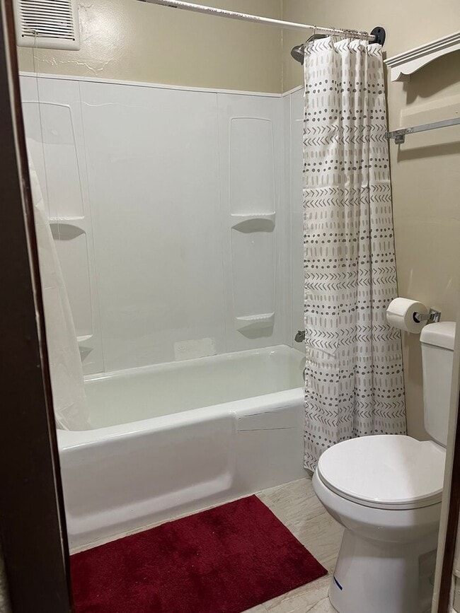 Building Photo - Clean 2 Bedroom home with hardwood flooring & large backyard