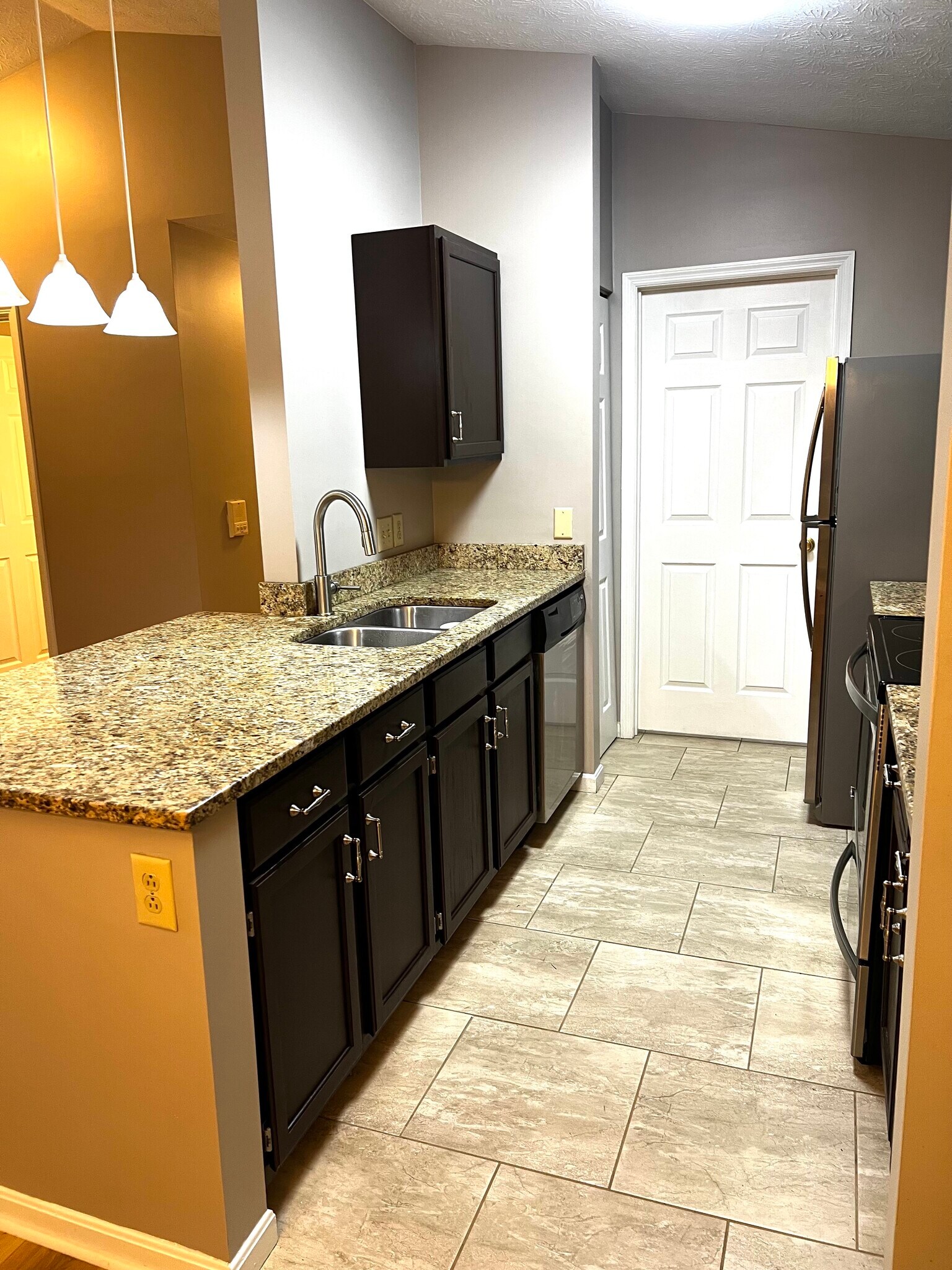 Separate laundry room attached to kitchen - 7680 Scioto Ct