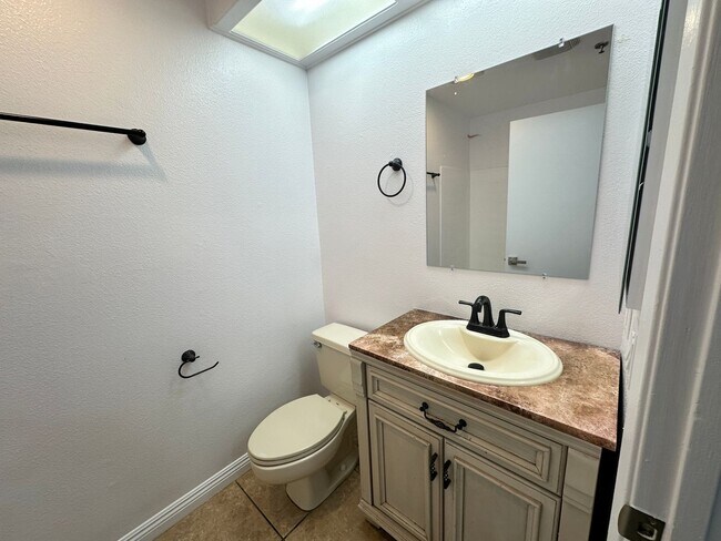 Building Photo - Front View of the Lake! Bright 2BR/2BA Ground Floor Condo with Tile Flooring & Parking