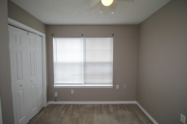 Building Photo - 2BR Patio Home with LVP Flooring, Private Fenced Yard, & Convenient Blue Angel Pkwy Location Near...