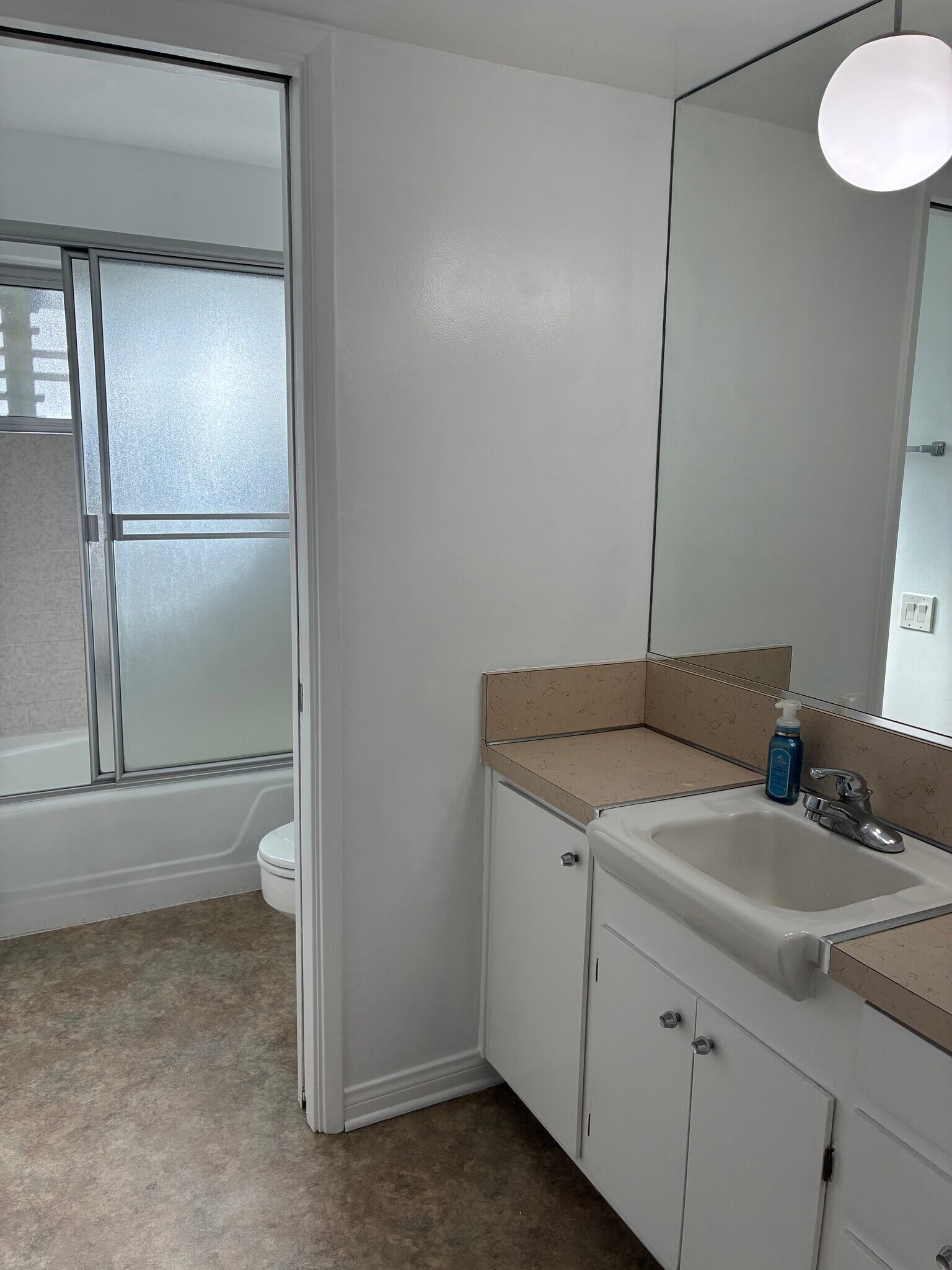 Full Bathroom pocket door to water closet with shower over tub. - 1520 Spruce St
