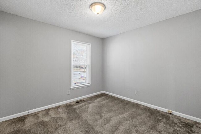 Building Photo - NE Home - Updated Kitchen and Bathrooms! SS Appliances, Fire Place, Front Porch & Deck, Fenced Yard!