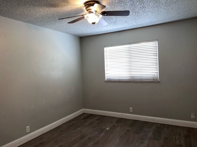 Building Photo - Laminate flooring throughout. Solar panels...