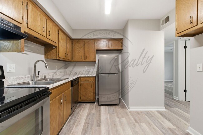 Building Photo - SPRING SPECIAL!! FIRST MONTH FREE on this Two Bedroom Condo, Garden Level with Washer/Dryer Hook ...