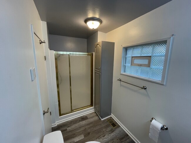The bathroom includes a convenient stand up shower with built in seating - 212 Lorenz Ave