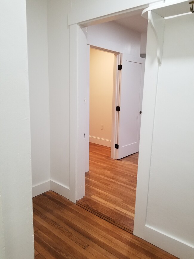 From Master walk-in closet looking through part of Master Bedroom to Apt. Entrance/Mudroom area - 111 Lake St