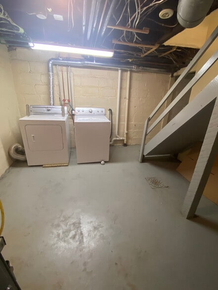 From kitchen to private lower level laundry/storage and entrance. - 136 Fairfield Ave