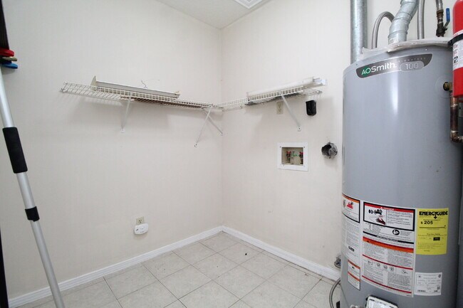 Building Photo - 2BR Home with Wood-Look Flooring, Fenced Backyard & Private Patio