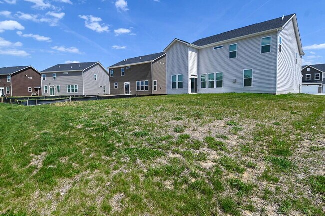 Building Photo - "Spacious 5-Bedroom Retreat with Luxurious Quartz Countertops & Fireplace on Deerberg Drive!"