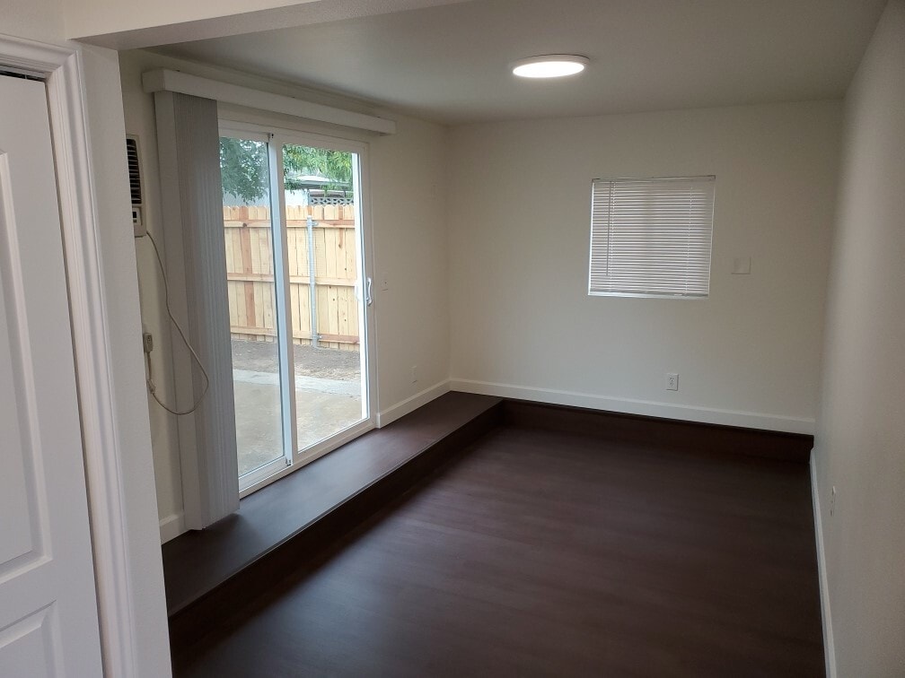 Living Room with Door to Fenced Back Yard - 9333 Lomita Dr