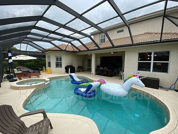 Building Photo - 4-Bedroom W/Den Lakefront Pool Home with Spa in Gated Promenade East at The Forum