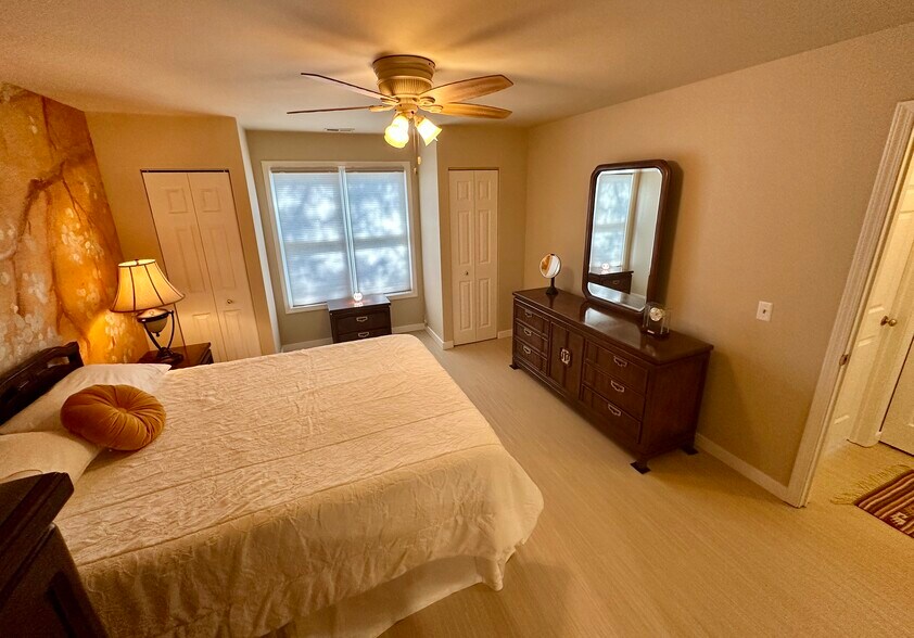 Master bedroom with long dresser w mirror. 2 addl closets. - 174 Hemingway Ct