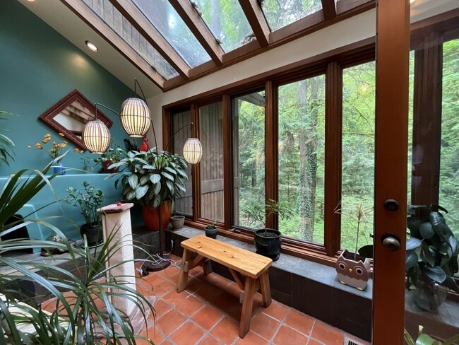 Building Photo - One-of-a-Kind Custom Home with Wall of Windows, Stone Fireplaces, Expansive Entertainment Space &...